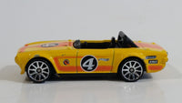 2011 Hot Wheels Track Stars Triumph TR6 Yellow #4 Die Cast Toy Race Car Vehicle