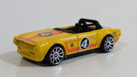 2011 Hot Wheels Track Stars Triumph TR6 Yellow #4 Die Cast Toy Race Car Vehicle