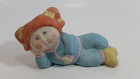 1984 OAA Cabbage Patch Kids Orange Hair Girl in Light Blue Laying Ceramic Figurine