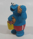 Applause Muppets Sesame Street Cookie Monster Character In Beach Shorts with a Pail of Shells Holding a Conch Shell To His Ear 3" Tall Hard Rubber PVC Toy