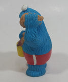 Applause Muppets Sesame Street Cookie Monster Character In Beach Shorts with a Pail of Shells Holding a Conch Shell To His Ear 3" Tall Hard Rubber PVC Toy