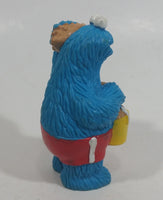 Applause Muppets Sesame Street Cookie Monster Character In Beach Shorts with a Pail of Shells Holding a Conch Shell To His Ear 3" Tall Hard Rubber PVC Toy