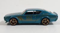 2014 Hot Wheels Night Burnerz Nissan Skyline H/T 2000GT-R Teal Die Cast Toy Car Vehicle