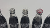 Vintage Enjoy Coca-Cola Coke Enjoy Sprite Different Languages 12 Miniature Glass Bottles in Red Plastic Holder