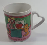 Enesco United Features Syndicate Jim Davis "Thanks for teaching me so good...er...well!" Garfield Giving Apple To Teacher Ceramic Coffee Mug with Heart Shaped Handle