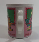 Enesco United Features Syndicate Jim Davis "Thanks for teaching me so good...er...well!" Garfield Giving Apple To Teacher Ceramic Coffee Mug with Heart Shaped Handle