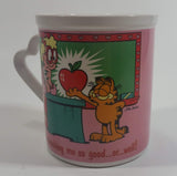 Enesco United Features Syndicate Jim Davis "Thanks for teaching me so good...er...well!" Garfield Giving Apple To Teacher Ceramic Coffee Mug with Heart Shaped Handle