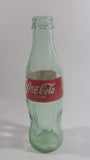 1999 Coca-Cola Classic '99 Winnipeg Pan American Games "The Spirit of Refreshment" 7 1/2" Tall 8 Fl oz. 237mL Glass Soda Pop Bottle