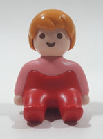 1990 Geobra Playmobil Female Girl Pink Shirt Red Pants Sitting 1 1/2" Tall Toy Figure