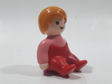 1990 Geobra Playmobil Female Girl Pink Shirt Red Pants Sitting 1 1/2" Tall Toy Figure