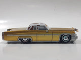 Disney Pixar Cars Cadillac Coupe de Ville Gold with Brown and White Cow Print Roof Die Cast Toy Car Vehicle