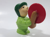 Man wearing Green Holding Red Plastic Saw 3" Tall Plastic Toy Figure