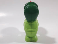 Man wearing Green Holding Red Plastic Saw 3" Tall Plastic Toy Figure