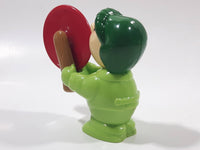 Man wearing Green Holding Red Plastic Saw 3" Tall Plastic Toy Figure