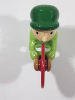 Man wearing Green Holding Red Plastic Saw 3" Tall Plastic Toy Figure