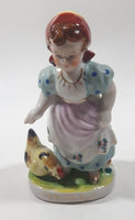 Antique 1945 to 1951 Occupied Japan Girl with Chicken Porcelain Lustreware 6" Tall Figure