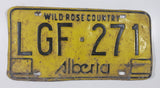 Vintage 1975 to 1984 Alberta Wild Rose Country Black Lettering Yellow Vehicle License Plate Metal Tag LGF 271