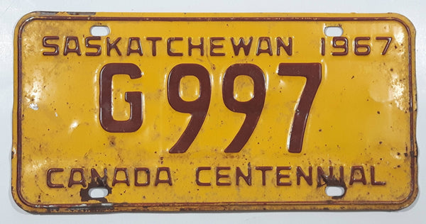 Vintage 1967 Saskatchewan Canada Centennial Maroon Letters Yellow Metal Government License Plate Tag G 997