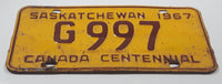 Vintage 1967 Saskatchewan Canada Centennial Maroon Letters Yellow Metal Government License Plate Tag G 997