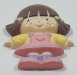 Mangelsen's Miniature Collection Girl in Pink Plastic Fridge Magnet Made in Hong Kong