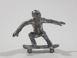 2011 NE-Rom Inc Miniature Silver Skateboarder 1 1/2" Tall Plastic Toy Figure