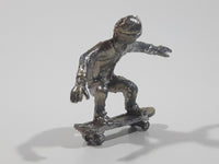 2011 NE-Rom Inc Miniature Silver Skateboarder 1 1/2" Tall Plastic Toy Figure