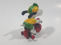 Vintage United Feature Peanuts Snoopy Learning To Ride A Bike On Bicycle With Training Wheels 2 1/2" Tall PVC Toy Figure Made in Hong Kong