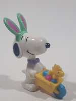 United Feature Peanuts Snoopy Easter Bunny Pushing Wheelbarrow Of Eggs with Woodstock 2 3/4" Tall PVC Toy Figure