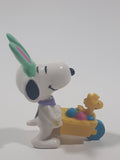 United Feature Peanuts Snoopy Easter Bunny Pushing Wheelbarrow Of Eggs with Woodstock 2 3/4" Tall PVC Toy Figure