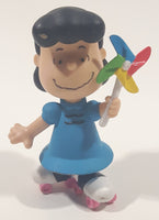 JP Just Play PNTS Peanuts Lucy Wearing Roller Skates Holding Rainbow Wind Pinwheel 3" Tall Vinyl Toy Figure