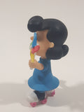 JP Just Play PNTS Peanuts Lucy Wearing Roller Skates Holding Rainbow Wind Pinwheel 3" Tall Vinyl Toy Figure