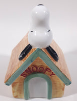 Peanuts Snoopy Laying On His Doghouse 5" Tall Ceramic Coin Bank