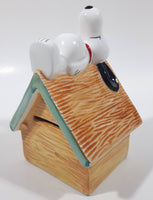 Peanuts Snoopy Laying On His Doghouse 5" Tall Ceramic Coin Bank