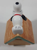 Peanuts Snoopy Laying On His Doghouse 5" Tall Ceramic Coin Bank