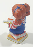 1984 OAA Panosh Place Cabbage Patch Kids Red Hair with Pigtails Sitting On Books Reading A Book 2 1/2" Tall PVC Toy Figure