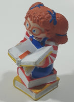 1984 OAA Panosh Place Cabbage Patch Kids Red Hair with Pigtails Sitting On Books Reading A Book 2 1/2" Tall PVC Toy Figure