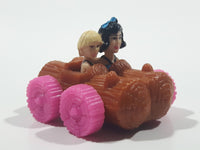 1993 McDonald's U.C.S. & Amblin The Flintstones Betty Rubble and Bamm Bamm in Log Car Plastic Toy Vehicle 1 3/4" Long