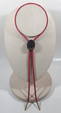 Western Gold Horse Shoe in Black Oval Red Draw String Bolo Tie