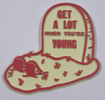 Vintage "Get A Lot When You're Young" Graveyard Plot Themed Rubber Fridge Magnet