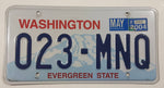 2004 Washington "Evergreen State" in Red on White and Blue Mountain Backdrop with Blue Letters Vehicle License Plate 023 MNQ