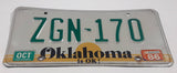 1986 Oklahoma is OK! Bright Yellow Sunset with Green Letters White Vehicle License Plate Tag ZGN 170