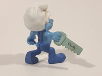 2011 Peyo "Carpenter" Smurf Holding a Saw with a Pencil in His Ear PVC Toy Figure McDonald's Happy Meal