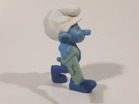 2011 Peyo "Carpenter" Smurf Holding a Saw with a Pencil in His Ear PVC Toy Figure McDonald's Happy Meal