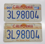 Matching Set of 2 1982-1989 California in Red with Yellow Sun, Stripes and The Golden State on White with Blue Letters Vehicle License Plate 3L98004