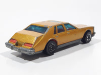 Vintage 1983 Hot Wheels Cadillac Seville Metalflake Gold Die Cast Toy Car Vehicle