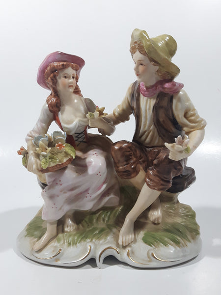 Vintage Man and Woman Sitting Holding Flowers 6 1/4" Tall Porcelain Figurine