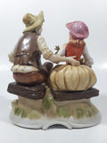 Vintage Man and Woman Sitting Holding Flowers 6 1/4" Tall Porcelain Figurine