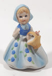 Vintage Girl and Blue and White Floral Dress Wearing a Bonnet and Holding a Basket 4 1/2" Tall Porcelain Figurine