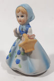 Vintage Girl and Blue and White Floral Dress Wearing a Bonnet and Holding a Basket 4 1/2" Tall Porcelain Figurine