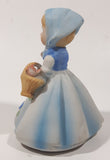 Vintage Girl and Blue and White Floral Dress Wearing a Bonnet and Holding a Basket 4 1/2" Tall Porcelain Figurine